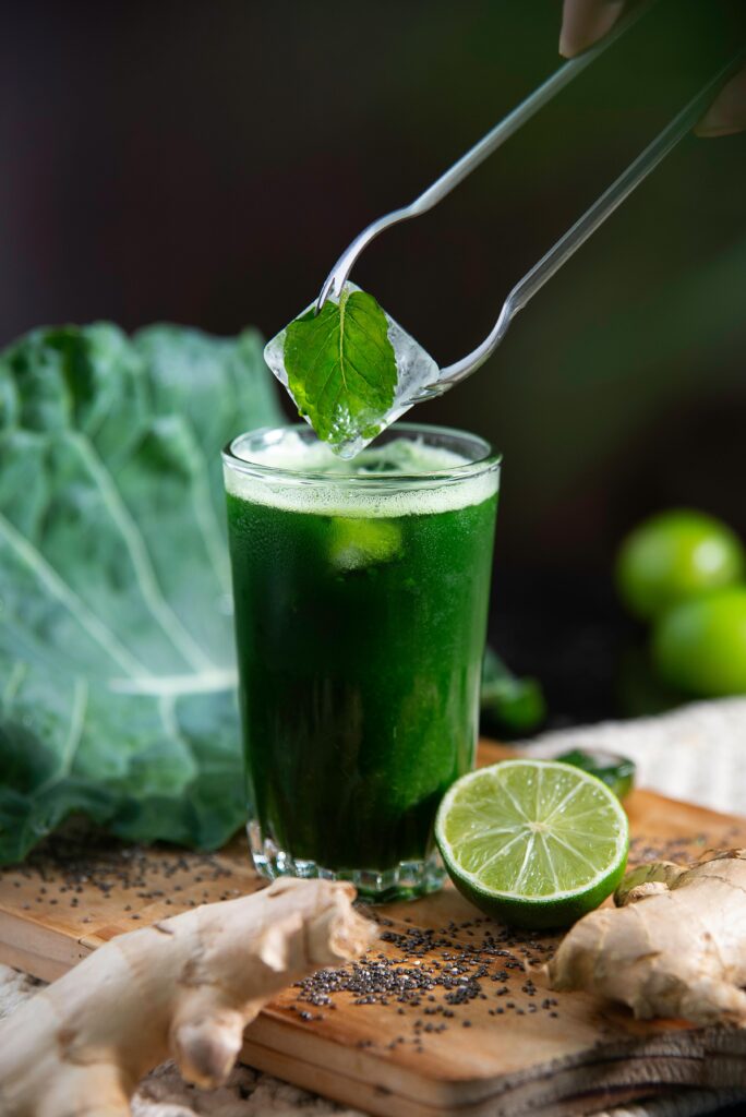 Vibrant green juice with lime and mint, perfect for a healthy energy boost.